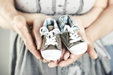 Fertility Counseling & Support, couple holding baby shoes